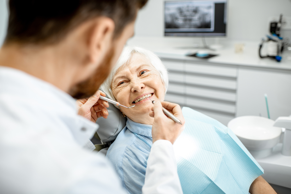 a senior citizen visiting the dentist for a cleaning