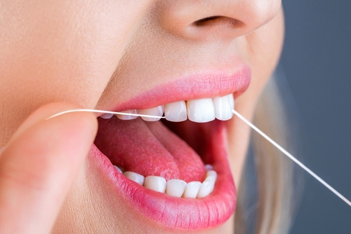 woman flossing