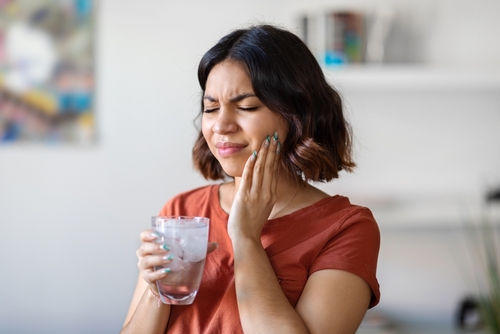Sensitive,Teeth.,Young,Arab,Woman,Drinking,Water