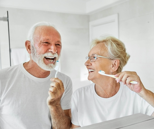 Elderly,Senior,Couple,Cleaning,Brushing,Their,Teeth